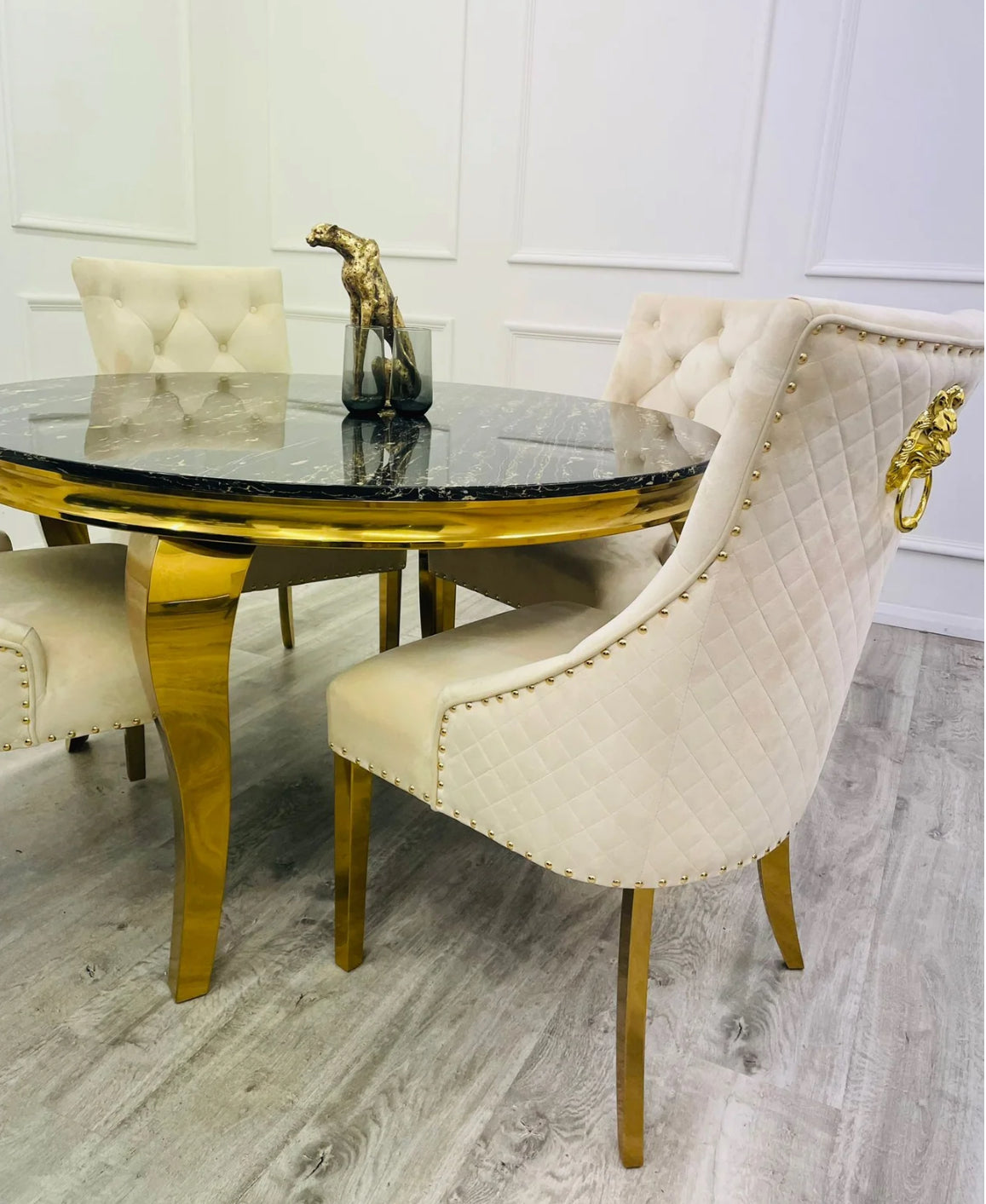 Louis 130cm Round Gold Marble Dining Table + Majestic Mink Gold Lion Knocker Dining Chairs